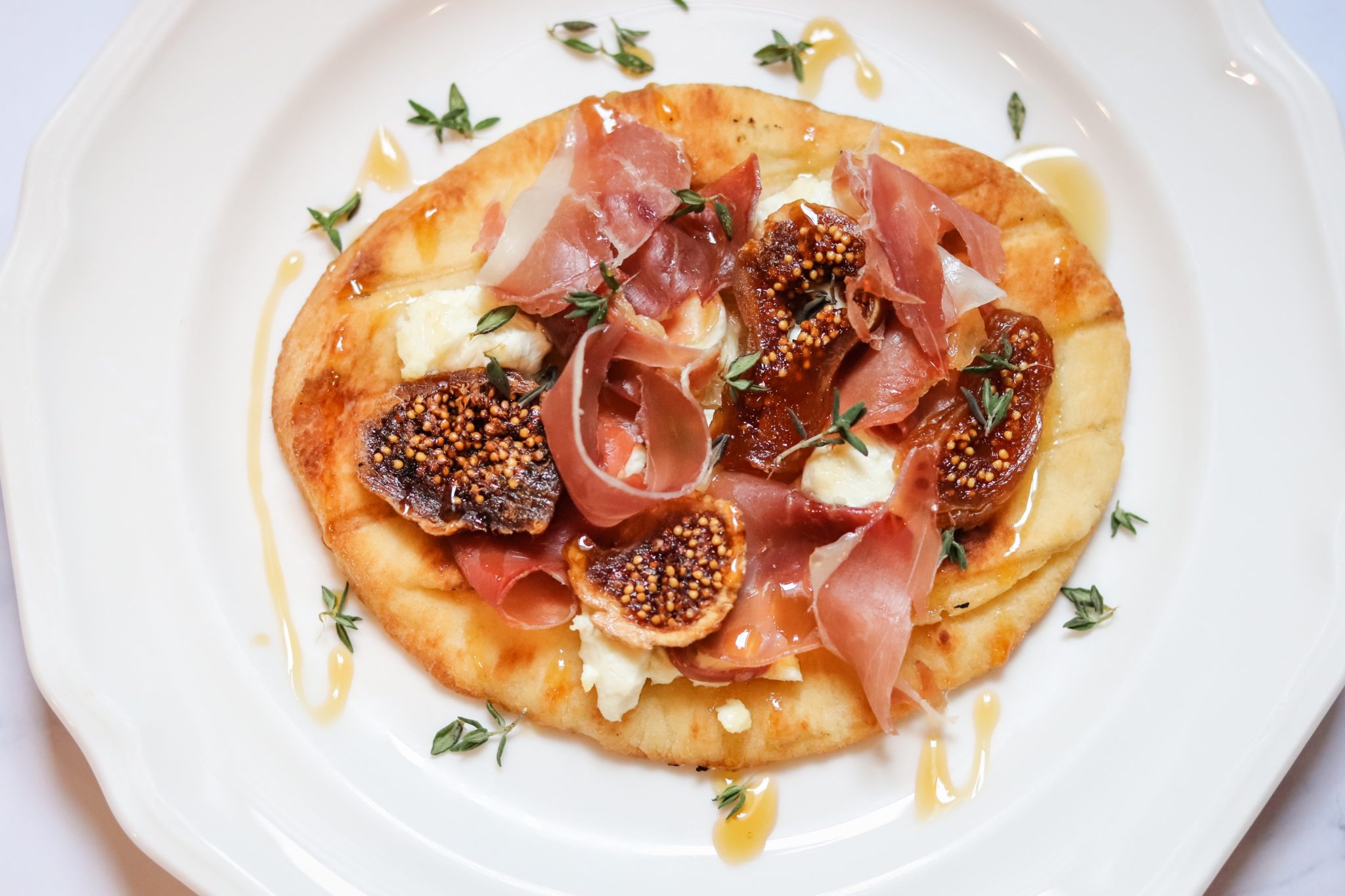 Prosciutto, Fig and Goat Cheese Flatbread with Thyme and Honey Caviar